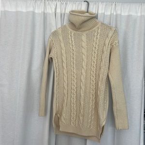 Cream colored turtleneck, classic sweater. Long but not a dress. Thick material!